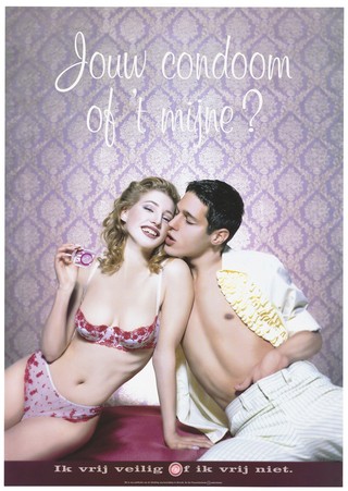 A woman in sexy lingerie holding a condom up asks her partner who wears an open frilled shirt and pin-striped trousers: 'Your condom or mine. I'll have safe sex or no sex"; an advertisement for safe sex by Stichting soa-bestrijding, Utrecht. Colour lithograph.