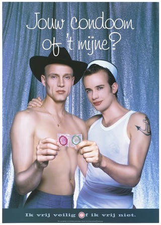 A gay couple, one wearing sailor attire and makeup, hold up condoms with the message: 'Your condom or mine. I have safe sex or no sex"; an advertisement for safe sex by Stichting soa-bestrijding, Utrecht. Colour lithograph.