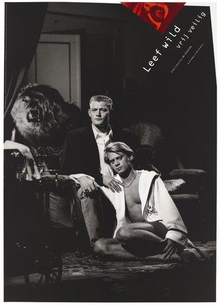 A man in a white bathrobe sits against the legs of a man dressed in a jacket and shirt with the head of a roaring lion to the left and the message to 'Live wild. Safe sex'; advertising the AIDS Information Line in Amsterdam. Colour lithograph by Hans Verschuuren for the Stuurgroep AIDSpreventie Homo's, 1991.