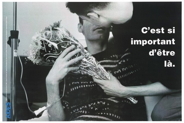 An AIDS patient on a drip receiving some flowers and an embrace from his companion with the message in French: "It is important to be there"; an advertisement by AIDES, the support group for those with HIV/AIDS. Colour lithograph by Emmanuelle Barbaras, 1994.