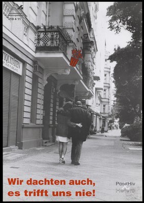 A couple walking arm in arm along Winterfeldtstrasse in Berlin-Schöneberg, unaware that a flower-pot is about to fall down on them from a balcony above; warning of the unexpected danger of HIV to heterosexual people. Colour lithograph by Positiv & Hetero, 199-.