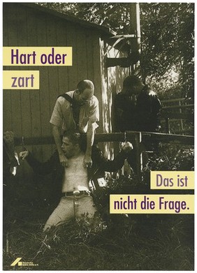 A man tweaking the nipples of a bare-chested man hand-cuffed to a fence with another gay couple beyond; advertising safe sex. Colour lithograph by Jörg Mang and Trash Line Design for the Deutsche AIDS-Hilfe e.V.