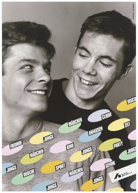 Two young men smiling at each other; an advertisement by Deutsche AIDS-Hilfe e.V. Colour lithograph by Reinhard Lorenz and Wolfgang Mudra.