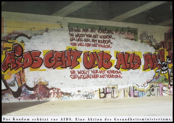 Graffiti on a wall stating "AIDS affects us all ..."; an advertisement for condoms as a protection against AIDS. Colour lithograph by Marat for the German Ministry of Health.