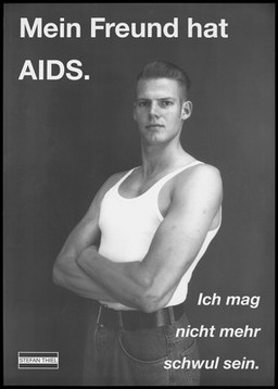A man in a white vest and jeans with his arms folded against a black background and the words in German: "My friend has AIDS. I may not be gay"; an anti-AIDS poster by Stefan Thiel. Lithograph.