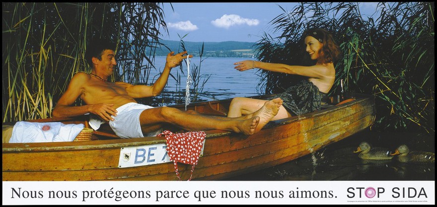 A lake setting in which a man lies back in a boat wearing only boxer shorts; he holds up some underwear which he offers to his female companion with a smile; a pink condom lies on a white garment beside the man while two ducks swim beside the boat; French version of a series of 'Stop SIDA' [Stop AIDS] campaign posters by the Federal Office of Public Health, in collaboration with l'Aide Suisse contre le SIDA. Colour lithograph.