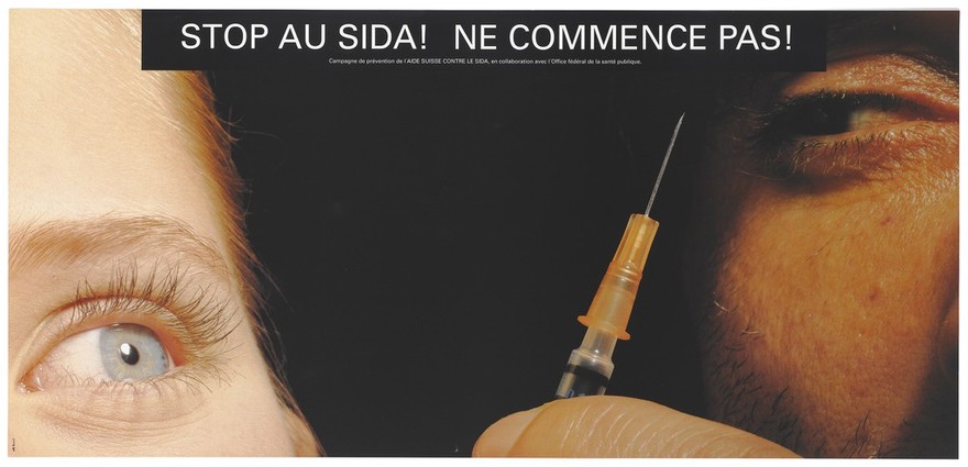 A woman's eye looking at the needle of a syringe pointing up towards a man's eye with the message in French: "Stop AIDS. Don't start!"; an anti-drugs advertisement from a campaign of 'STOP AIDS posters by the l'AIDE Suisse contre le SIDA in collaboration with the Federal Office of Public Health. Colour lithograph.