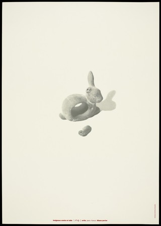 A cast of a rabbit with a hole in the middle and one ear missing appearing to float within a neutral background; advertising the danger of AIDS. Colour lithograph by Liliana Porter, [1995].