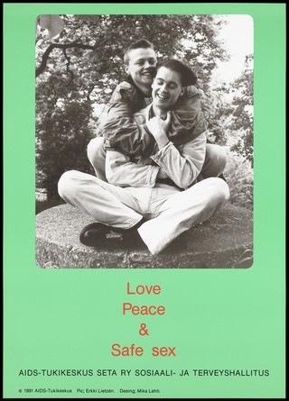 A man smiling with his legs crossed being hugged by his gay partner as they sit on a round stone; a safe-sex and AIDS prevention advertisement for the AIDS-Tukikeskus, the AIDS support centre by the Finnish AIDS Council. Colour lithograph by Erkki Lietzén and Mika Lahti, 1991.