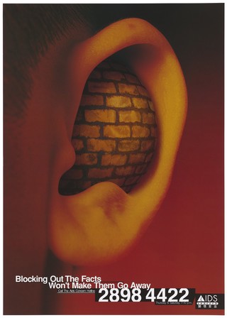An ear filled with a bulging brick wall representing the problems of not listening to the facts about AIDS; advertising the AIDS Concern Hotline, Hong Kong. Colour lithograph, ca. 1997.