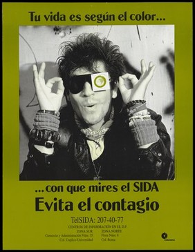 A man in a leather jacket wearing sunglasses with one eye covered with a green condom; a warning about the dangers of being (colour) blind to AIDS by ConaSIDA. Colour lithograph by Gabriel Figueroa Flores, ca. 1994.