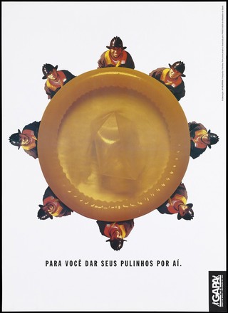 Firemen standing around the circumferance of a large orange condom as though it was a safety net; a safe-sex and AIDS prevention advertisement by Gapa RS. Colour lithograph by Chitolina, ca. 1996.
