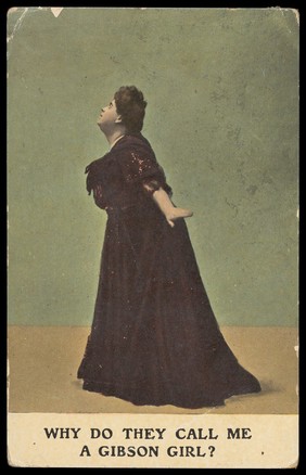 A man in a large dark coloured dress adopting a standing pose in profile. Colour process print, 1910.