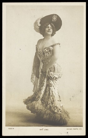 John Lindstrom (? Lind) in drag. Photographic postcard, 19--.