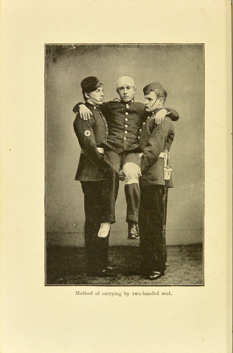 Method of carrying by two-handed seat.