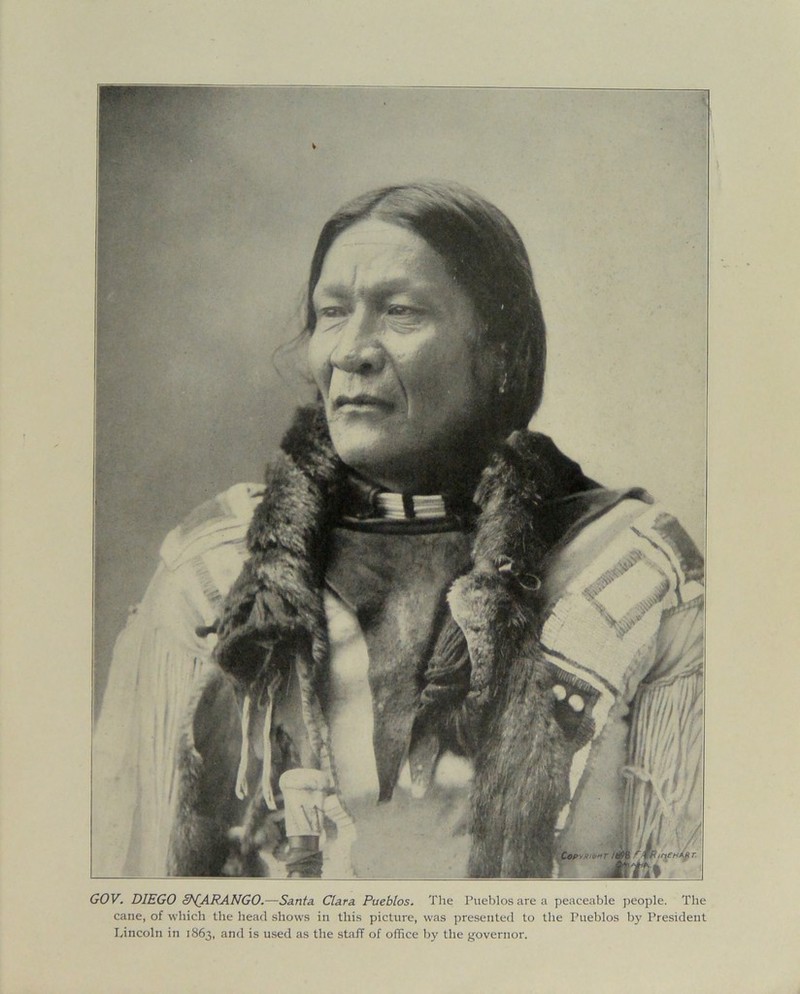 cane, of which the head shows in this picture, was presented to the Pueblos by President Lincoln in 1863, and is used as the staff of office by the governor.