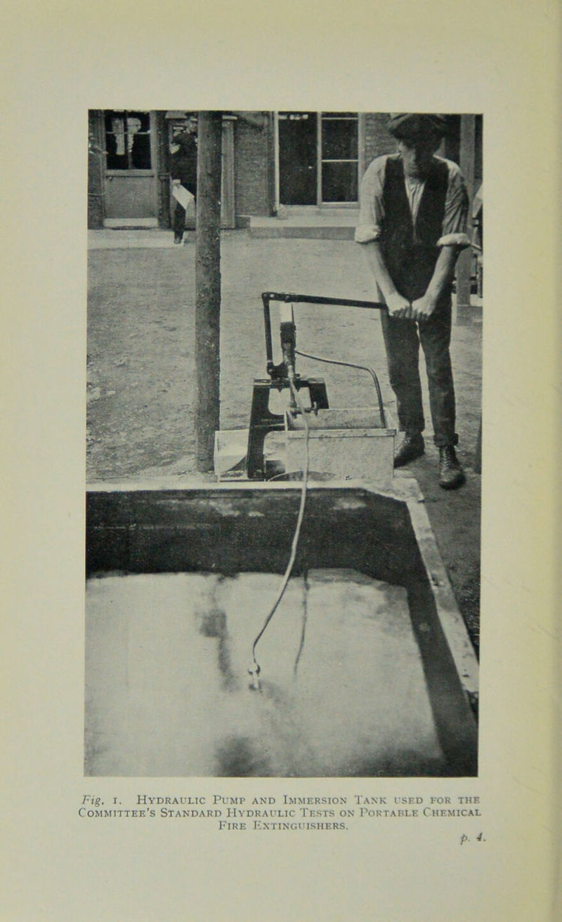 Fig. i. Hydraulic Pump and Immersion Tank used for the Committee’s Standard Hydraulic Tests on Portable Chemical Fire Extinguishers.
