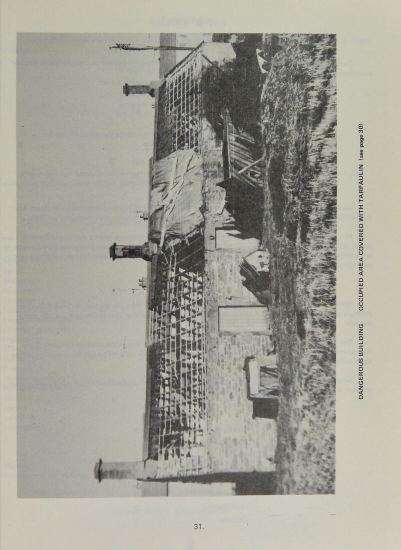 DANGEROUS BUILDING OCCUPIED AREA COVERED WITH TARPAULIN (see page 30)