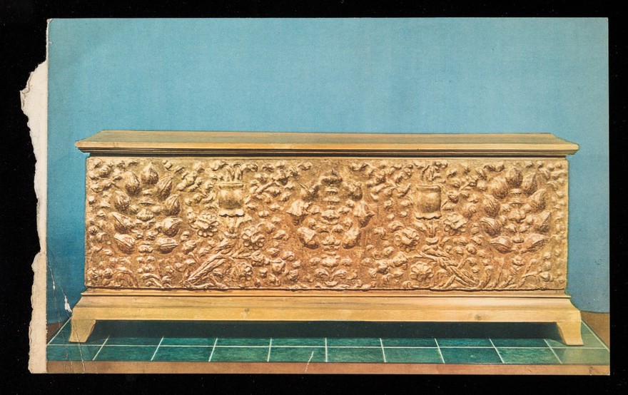 Front of a gilt stucco chest with pomegranate motif. Tuscany. XVth century.
