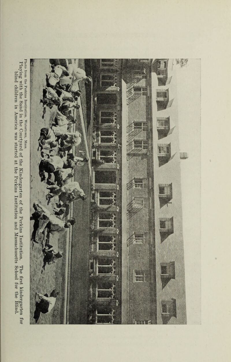 Photo from the Perkins Institution. Watertown, Mass. Playing with the Sand in the Courtyard of the Kindergarten of the Perkins Institution. The first kindergarten for blind children in America was started at the Perkins Institution and Massachusetts School for the Blind.