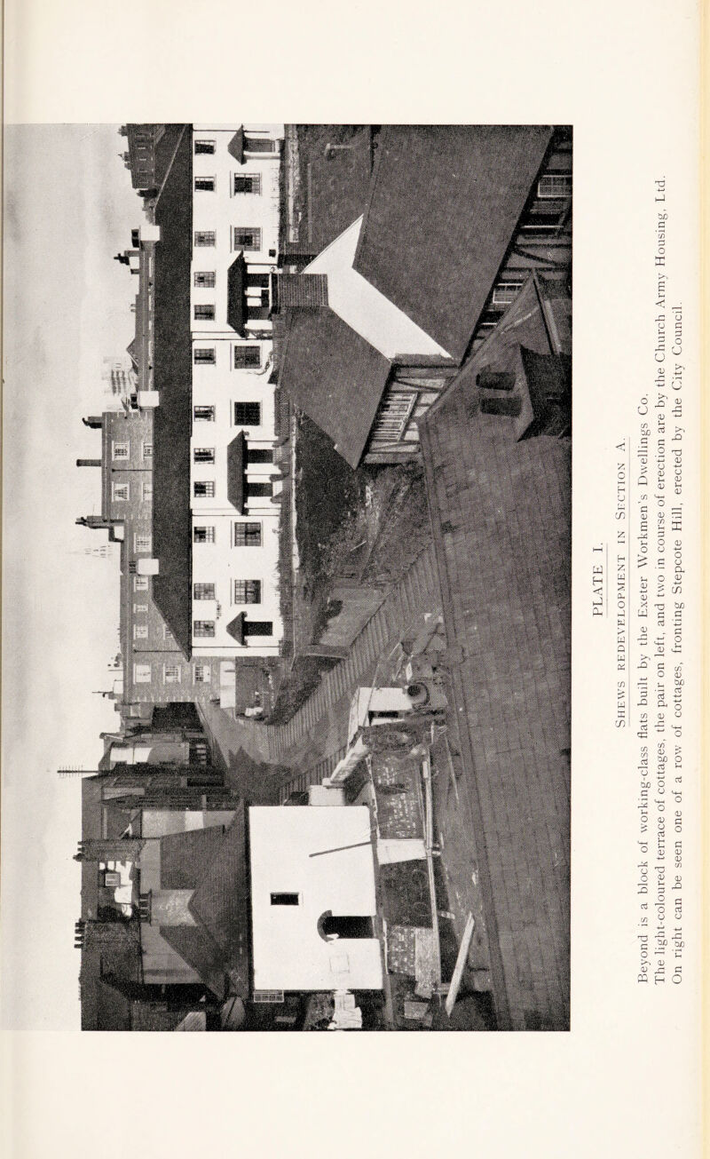 Beyond is a block of working-class flats built by the Exeter Workmen’s Dwellings Co.