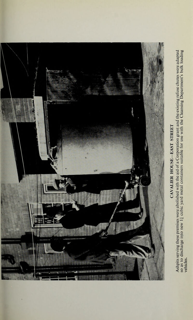 Ashpits serving these premises were abolished with the aid of a Corporation grant and the existing refuse chutes were adapted so as to discharge into new 1] cubic yard metal containers suitable for use with the Cleansing Department’s bulk loading vehicles.