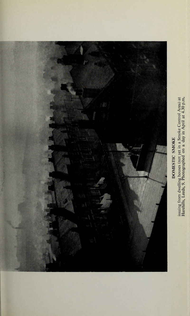 issuing from dwelling houses (not yet in a Smoke Control Area) at Harehills, Leeds, 9. Photographed on a day in April at 4.30 p.m.