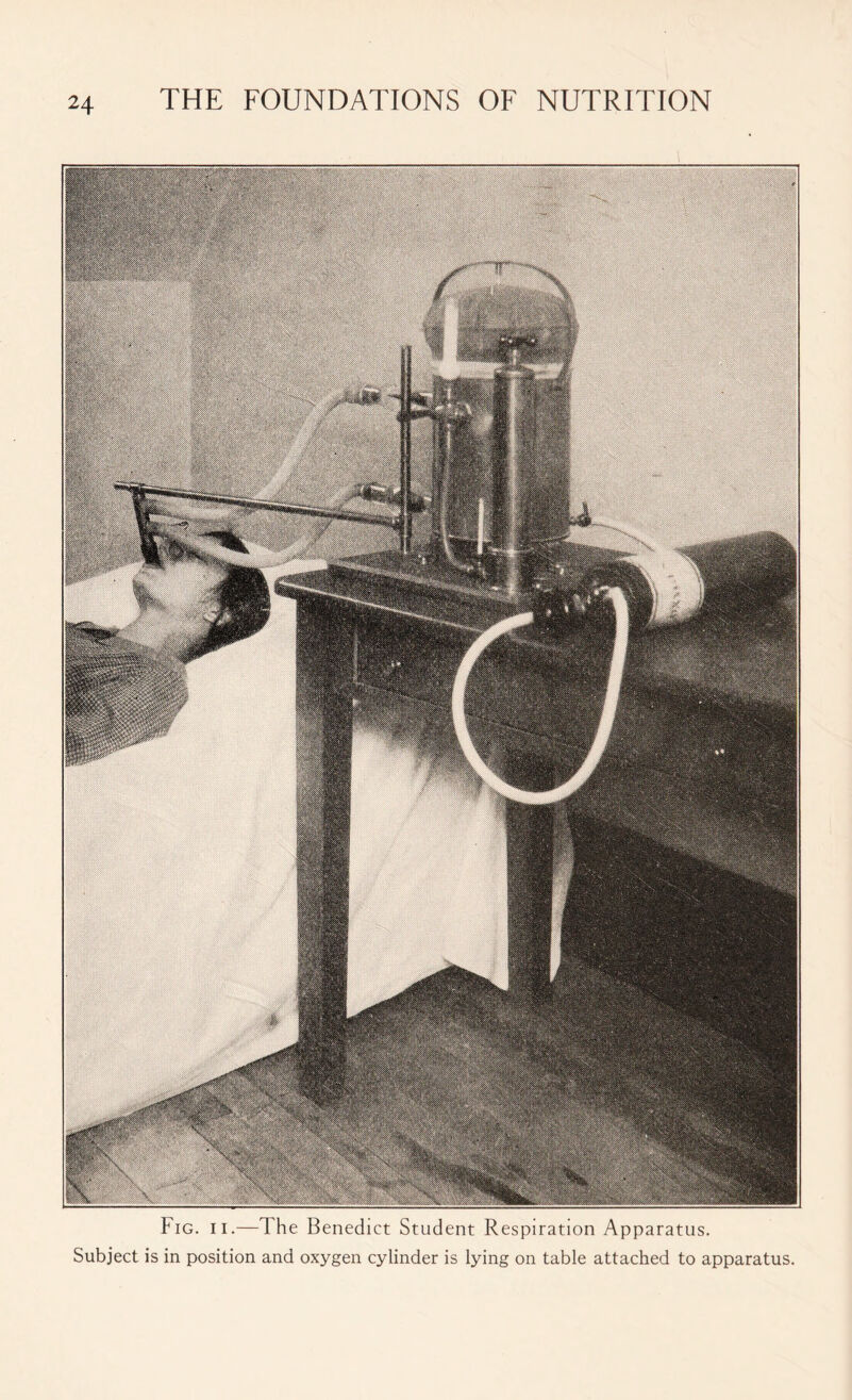 Fig. ii.—1 he Benedict Student Respiration Apparatus. Subject is in position and oxygen cylinder is lying on table attached to apparatus.