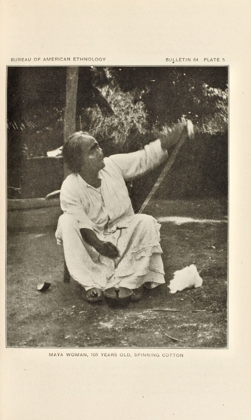 MAYA WOMAN, 105 YEARS OLD, SPINNING COTTON