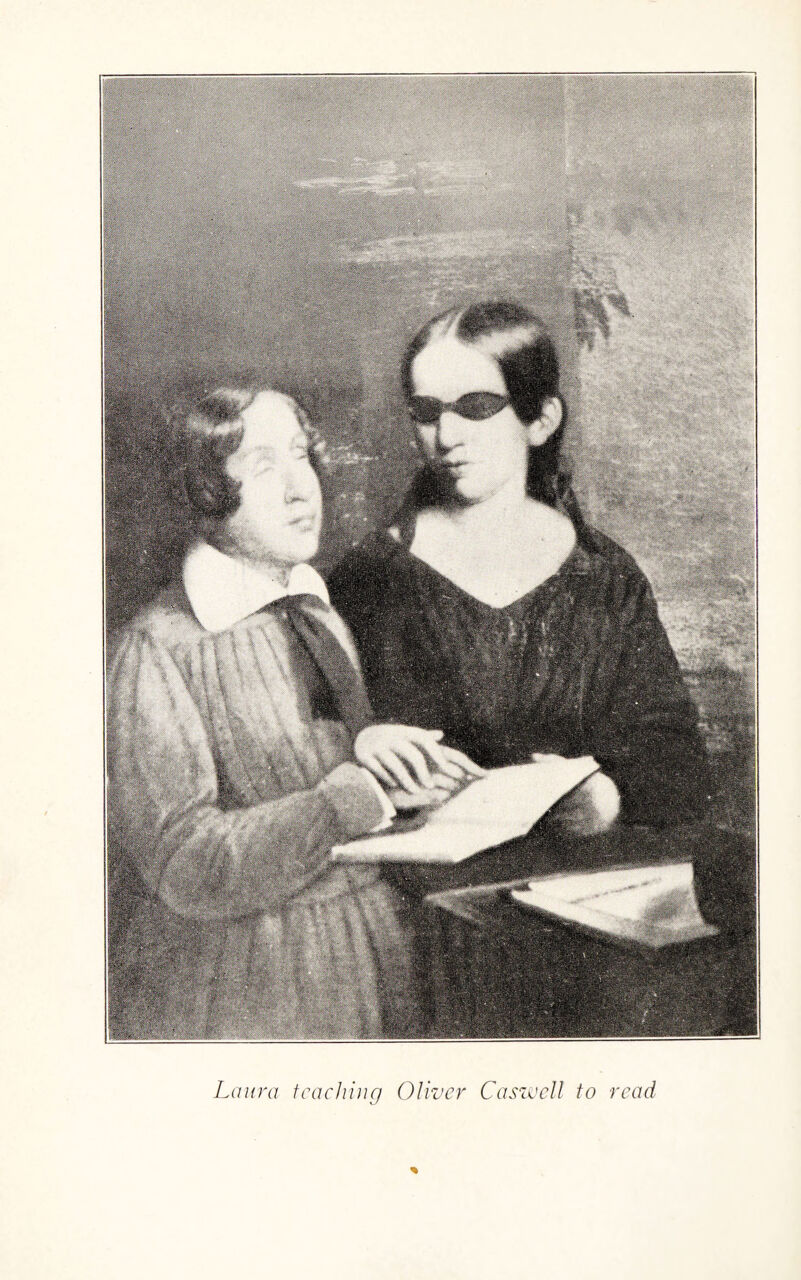 Laura teaching Oliver Caswell to read