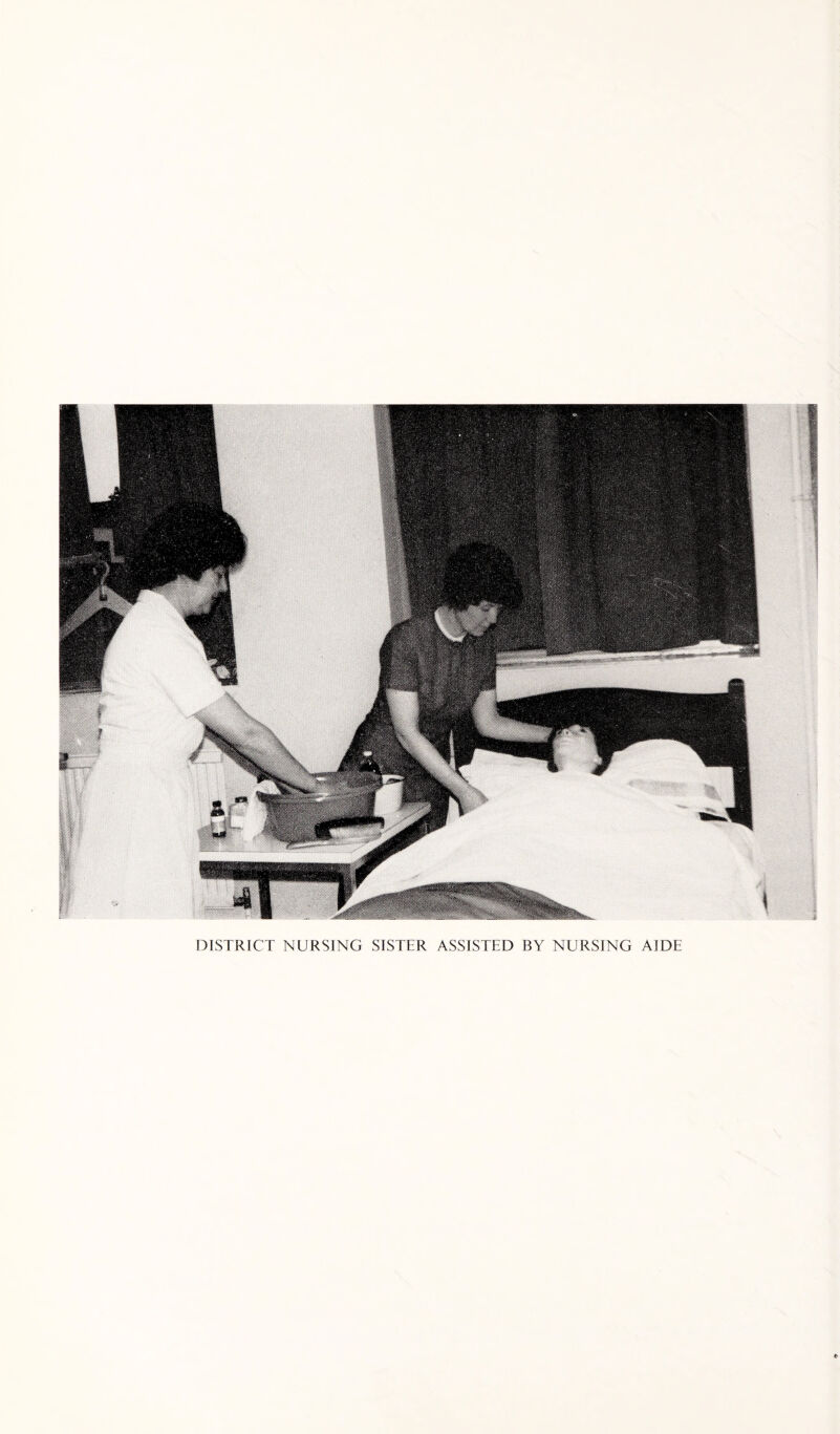 DISTRICT NURSING SISTER ASSISTED BY NURSING AIDE