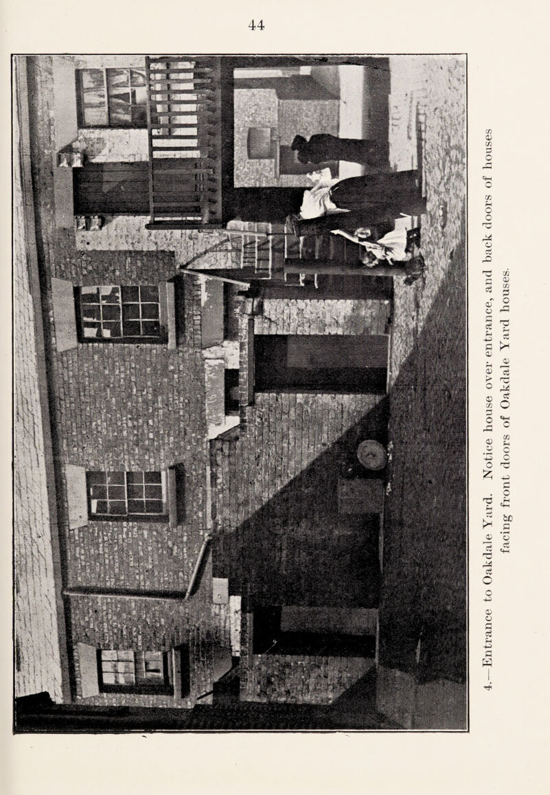 44 -Entrance to Oakdale Yard. Notice house over entrance, and back doors of houses facing front doors of Oakdale Yard houses.