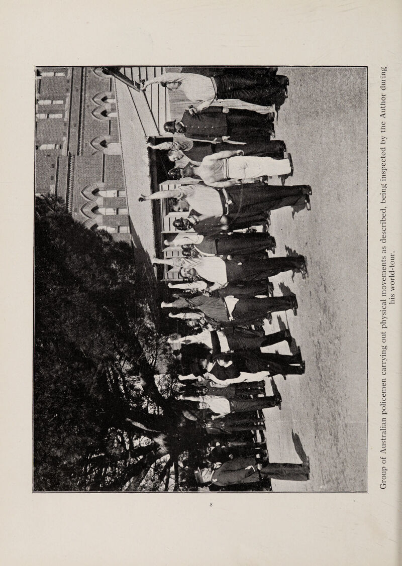 Group of Australian policemen carrying out physical movements as described, being inspected by the Author during his world-tour.