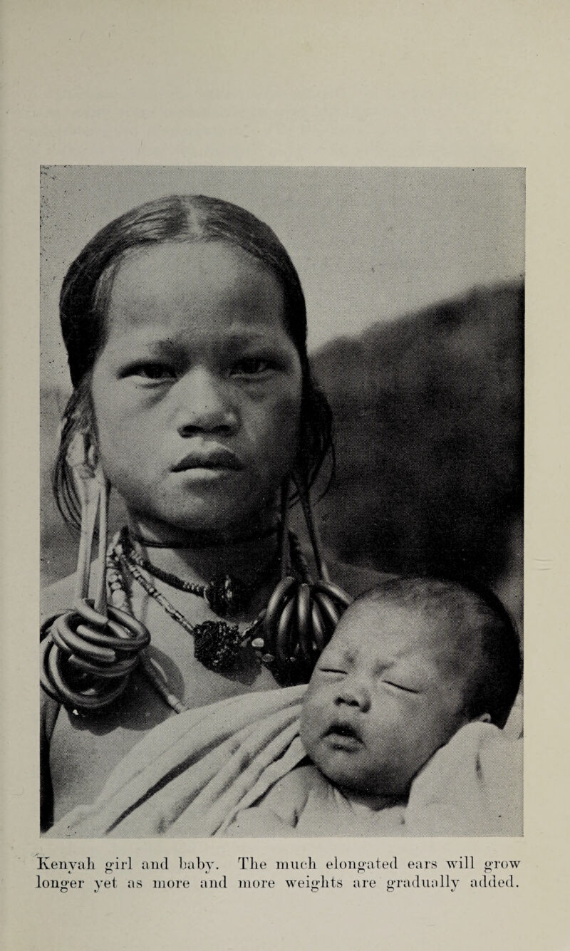 Kenvah girl and baby. The much elongated ears will grow longer yet as more and more weights are gradually added.