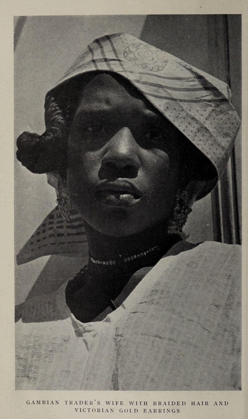 GAMBIAN TRADER’S WIFE WITH BRAIDED HAIR AND VICTORIAN G O LD EARRINGS