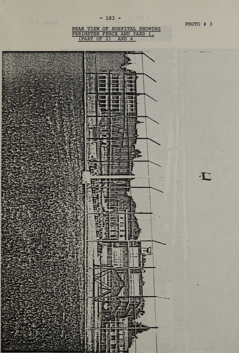 PHOTO # 3 REAR VIEW OF HOSPITAL SHOWING PERIMETER FENCE AND YARD 1 ld AND 4 (PART OF 2) 