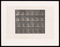 view A naked child gives a bouquet to a semi-naked woman sitting on the ground. Collotype after Eadweard Muybridge, 1887.