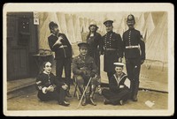 view Characters on the set of a play. Photographic postcard. 191-.