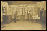 view Three actors performing at a prisoner of war camp in Münster. Photographic postcard, ca. 1916.