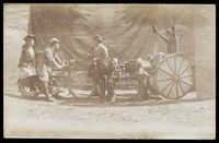 view Four British servicemen performing a sketch with vehicles. Photograph, 191-.