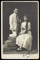 view Ern and Chick, two actors, Chick in drag, pose in summer attire. Photographic postcard, ca. 1918.