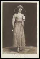 view A.P. Holland in drag posing for the Bow Bells concert party. Photographic postcard, 191-.