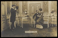 view French prisoners of war, one in drag, performing a show at a prisoner of war camp in Cottbus, with an elaborate stage set. Photographic postcard, 191-.