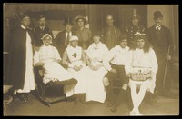 view Amateur actors, some in drag, pose for a group portrait. Photographic postcard, 191-.