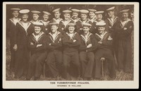 view British prisoners of war posing for "The Timbertown Follies", at a prisoner of war camp in Groningen. Photographic postcard, 191-.