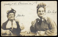 view J. Brittain and Fred Powell posed in character as old women.