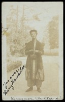 view Harry Hawksbee wearing a large coat and bonnet.