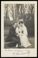 view Two actors pose as a wedded couple.