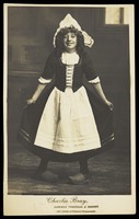 view Charlie Bray in character as a Dutch girl. Photographic postcard, 191-.