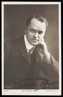 view Malcolm Scott posing for a portrait. Photographic postcard, 1906.